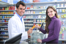 Pharmacist checking the prescription of a senior